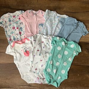 7 baby girl onesies (Carter Brand)
